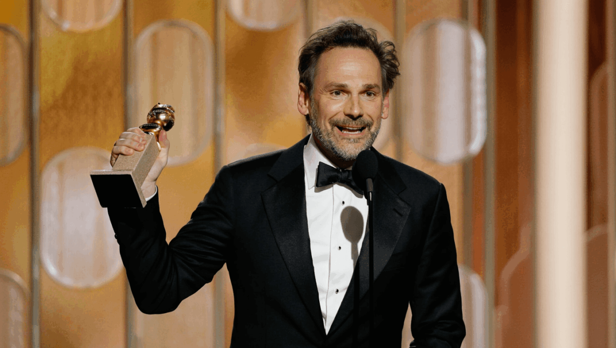 Paul Thomas Anderson wins Golden Globe for screenplay as Maya Rudolph cheers on