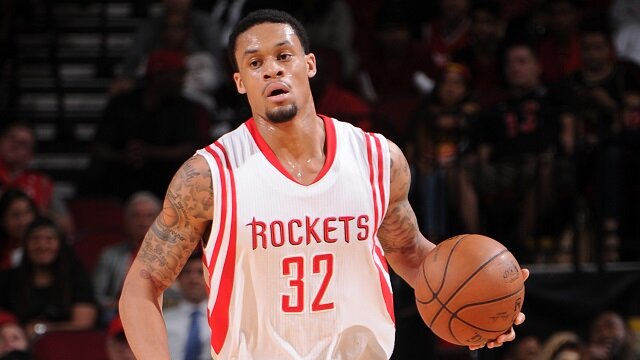 HOUSTON, TX - APRIL 15: K.J. McDaniels #32 of the Houston Rockets handles the ball against the Utah Jazz on April 15, 2015 at the Toyota Center in Houston, Texas. NOTE TO USER: User expressly acknowledges and agrees that, by downloading and or using this photograph, User is consenting to the terms and conditions of the Getty Images License Agreement. Mandatory Copyright Notice: Copyright 2015 NBAE (Photo by Bill Baptist/NBAE via Getty Images)
